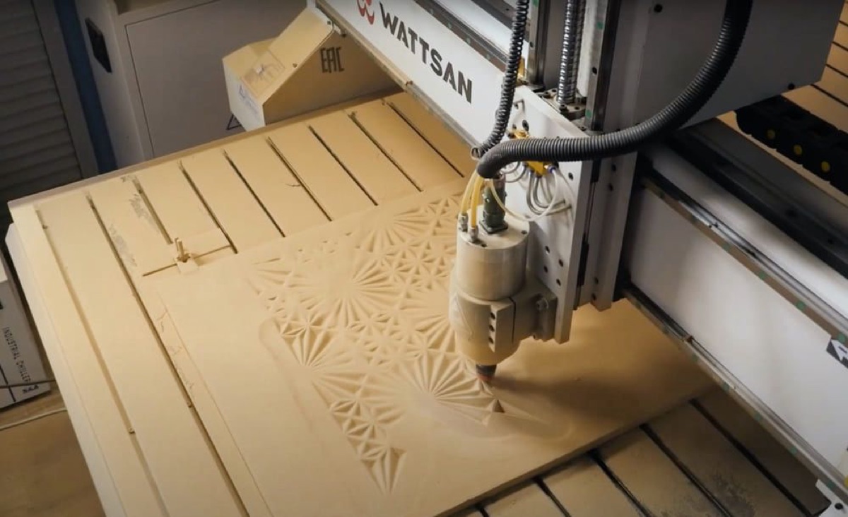 CNC router carving 3D relief into an MDF board